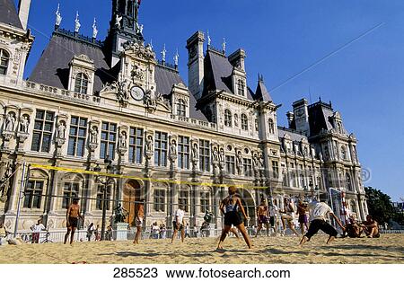 People playing volleyball in front of building, Paris, Ile-de-France, France View Large Photo Image Stock Image - People playing volleyball in front of building, Paris, Ile-de-France, France . Fotosearch