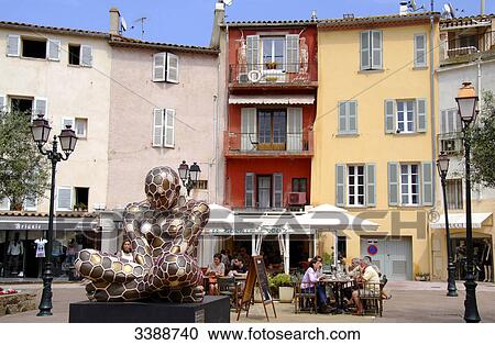 Stock Image - People sitting in pavement cafe, St. Tropez, France . Fotosearch