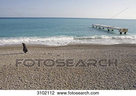 Person at beach, Nice, France View Large Photo Image Stock Image - Person at beach, Nice, France . Fotosearch