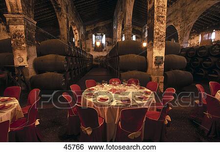 Place setting inside cellar with wine casks, El Puerto de Santa Maria, Cadiz, Andalusia, Spain View Large Photo Image Stock Photograph - Place setting inside cellar with wine casks, El Puerto de Santa Maria, Cadiz, Andalusia, Spain . Fotosearch