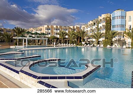 Pool in front of buildings, Hammamet, Tunisia View Large Photo Image Stock Photograph - Pool in front of buildings, Hammamet, Tunisia . Fotosearch