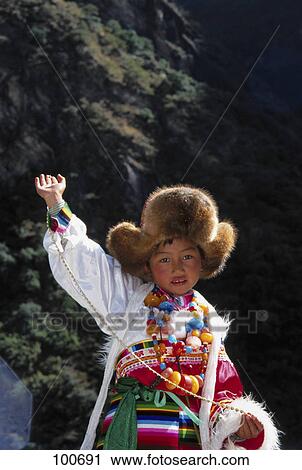 Portrait of girl posing in traditional clothing, Lijiang, China View Large Photo Image Stock Image - Portrait of girl posing in traditional clothing, Lijiang, China . Fotosearch