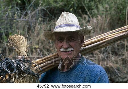 Portrait of old farmer holding bunch of sticks and smiling, Andalucia, Spain View Large Photo Image Stock Image - Portrait of old farmer holding bunch of sticks and smiling, Andalucia, Spain . Fotosearch
