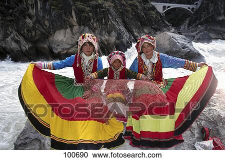 Portrait of three girls posing in traditional clothing, Yangtze River, Lijiang, China View Large Photo Image Stock Image - Portrait of three girls posing in traditional clothing, Yangtze River, Lijiang, China . Fotosearch