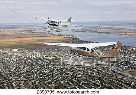 Propeller planes flying over Saint-Laurent river, Canada, Quebec View Large Photo Image Stock Photography - Propeller planes flying over Saint-Laurent river, Canada, Quebec . Fotosearch