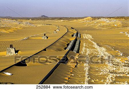 Railroad tracks passing through desert, Dakhla Oasis, Egypt View Large Photo Image Picture - Railroad tracks passing through desert, Dakhla Oasis, Egypt . Fotosearch