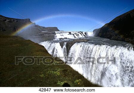 Rainbow over waterfall, Gullfoss Waterfall, Iceland View Large Photo Image Stock Photo - Rainbow over waterfall, Gullfoss Waterfall, Iceland . Fotosearch