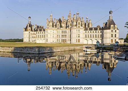 Stock Image - Reflection of castle in water, Chateau De Chambord, Chambord, Loir-Et-Cher, France . Fotosearch