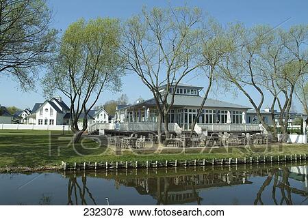 Stock Photo - Reflection of holiday resort in water, Schwielowsee, Brandenburg, Germany . Fotosearch