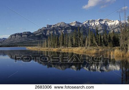 Reflection of mountain in water, Talbot Lake, Miette Range, Jasper National Park, Alberta, Canada View Large Photo Image Stock Photograph - Reflection of mountain in water, Talbot Lake, Miette Range, Jasper National Park, Alberta, Canada . Fotosearch