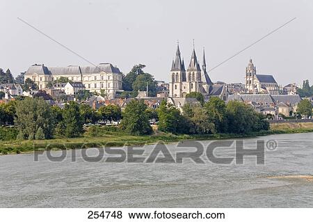 Stock Photo - River flowing near town, Loire River, Loire Valley, Loir-Et-Cher, France . Fotosearch