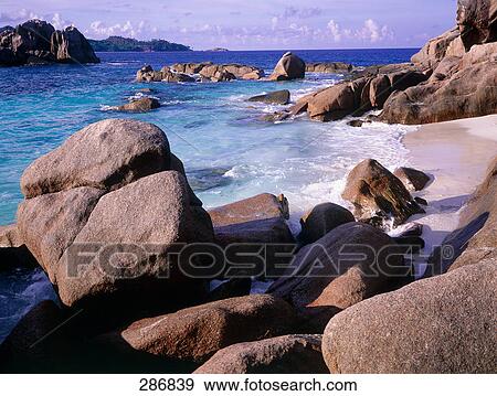 Rock formations at beach, Saint Pierre Islet, Praslin Island, Seychelles View Large Photo Image Stock Photo - Rock formations at beach, Saint Pierre Islet, Praslin Island, Seychelles . Fotosearch