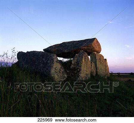 Rocks on grassy landscape at dusk, Sweden  View Large Photo Image Stock Photo - Rocks on grassy landscape at dusk, Sweden . Fotosearch