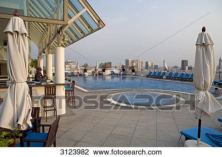 Rooftop swimming pool in a hotel, Ho Chi Minh City, Vietnam View Large Photo Image Stock Image - Rooftop swimming pool in a hotel, Ho Chi Minh City, Vietnam . Fotosearch
