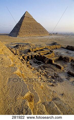 Stock Image - Ruins near pyramid in desert, Giza Pyramids, Giza, Cairo, Egypt . Fotosearch