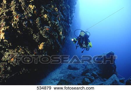 Scuba diver exploring under the sea, Grotto Cave, Corfu Island, Greece View Large Photo Image Stock Photo - Scuba diver exploring under the sea, Grotto Cave, Corfu Island, Greece . Fotosearch
