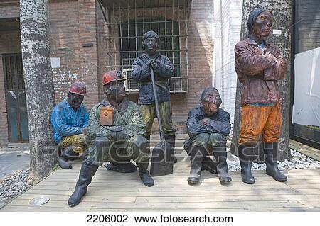 Sculptures of miners in front of building View Large Photo Image Stock Image - Sculptures of miners in front of building . Fotosearch