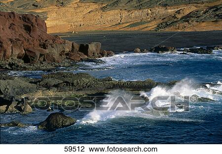Sea waves crashing on the coast, Lanzarote, Canary Islands, Spain View Large Photo Image Stock Image - Sea waves crashing on the coast, Lanzarote, Canary Islands, Spain . Fotosearch