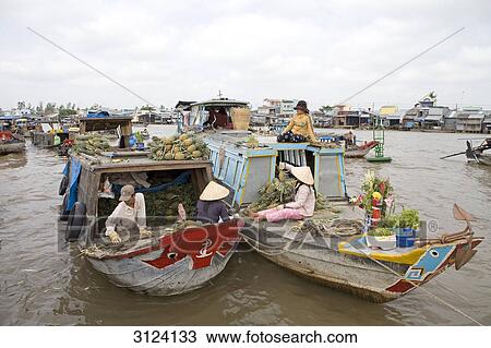 Sellers on boats at a floating market, Mekong Delta, Vietnam View Large Photo Image Stock Image - Sellers on boats at a floating market, Mekong Delta, Vietnam . Fotosearch