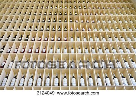 Stock Photo - Shelf with wine bottles, Elciego, Spain, low angle view . Fotosearch