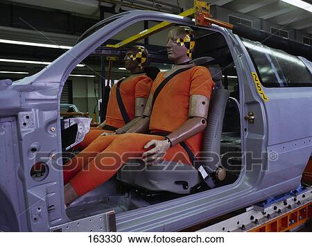 Stock Image - Side profile of mannequins in car for crash test . Fotosearch