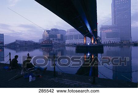 Silhouette of bridge across river, Canary Wharf, Thames River, Tower Bridge, London, England View Large Photo Image Stock Image - Silhouette of bridge across river, Canary Wharf, Thames River, Tower Bridge, London, England . Fotosearch