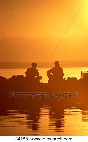 Silhouette of fishermen fishing in lake, Lake Balaton, Hungary View Large Photo Image Stock Photo - Silhouette of fishermen fishing in lake, Lake Balaton, Hungary . Fotosearch