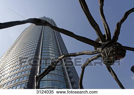Skyscraper and spider sculpture, Tokyo, Japan, low angle view View Large Photo Image Stock Photography - Skyscraper and spider sculpture, Tokyo, Japan, low angle view . Fotosearch