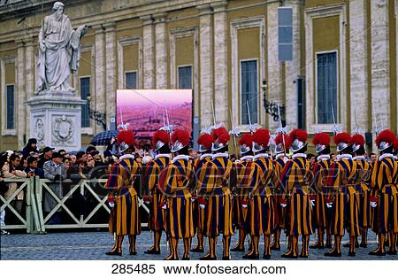 Spectators watching participants in religious procession, St. Peters Basilica, St. Peters Square, Rome, Italy View Large Photo Image Stock Photography - Spectators watching participants in religious procession, St. Peters Basilica, St. Peters Square, Rome, Italy . Fotosearch