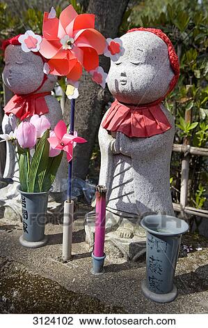 Statues of Jizo at a buddhist temple, Tokyo, Japan, close-up View Large Photo Image Stock Image - Statues of Jizo at a buddhist temple, Tokyo, Japan, close-up . Fotosearch