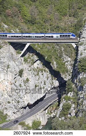 Subway train moving on bridge, Saorge, Roya Bevera Valley, Alpes-Maritimes, Provence-Alpes-Cote d'Azur, France View Large Photo Image Picture - Subway train moving on bridge, Saorge, Roya Bevera Valley, Alpes-Maritimes, Provence-Alpes-Cote d'Azur, France . Fotosearch