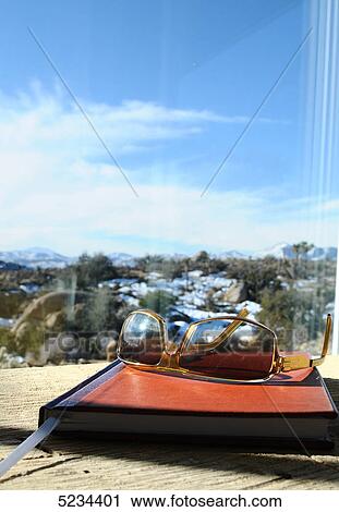 Sunglasses and book View Large Photo Image Stock Image - Sunglasses and book . Fotosearch