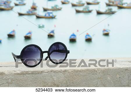 Sunglasses on wall, Mui Ne, Vietnam, Asia View Large Photo Image Stock Image - Sunglasses on wall, Mui Ne, Vietnam, Asia . Fotosearch