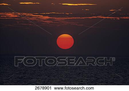 Stock Image - Sunset over sea, Baltic Sea . Fotosearch