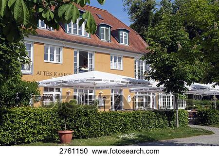 Stock Image - Sunshades in front of hotel, Neuruppin, Brandenburg, Germany . Fotosearch