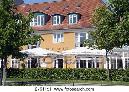 Sunshades in front of hotel, Neuruppin, Brandenburg, Germany View Large Photo Image Stock Image - Sunshades in front of hotel, Neuruppin, Brandenburg, Germany . Fotosearch