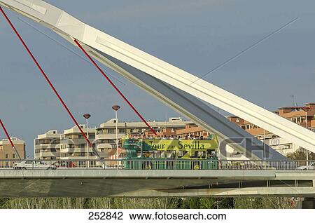 Tour bus on bridge, Guadalquivir River, Andalusia, Spain View Large Photo Image Stock Image - Tour bus on bridge, Guadalquivir River, Andalusia, Spain . Fotosearch
