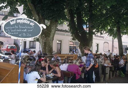 Tourists at outdoor cafe, Franconia, Bavaria, Germany View Large Photo Image Stock Photo - Tourists at outdoor cafe, Franconia, Bavaria, Germany . Fotosearch
