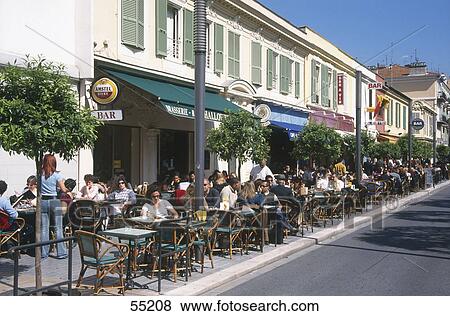 Tourists at outdoor cafe, Nice, France View Large Photo Image Stock Photo - Tourists at outdoor cafe, Nice, France . Fotosearch