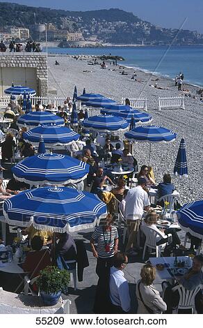 Tourists at outdoor cafe, Nice, France View Large Photo Image Stock Photo - Tourists at outdoor cafe, Nice, France . Fotosearch