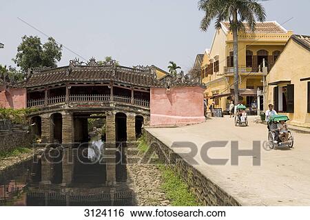 Tourists driving rickshaw in Hoi An, Vietnam View Large Photo Image Stock Photograph - Tourists driving rickshaw in Hoi An, Vietnam . Fotosearch