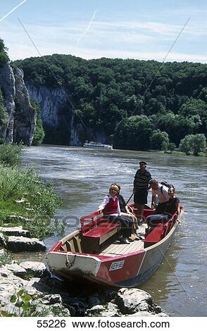Tourists in boat at riverside, Danube River, Franconia, Bavaria, Germany View Large Photo Image Stock Photograph - Tourists in boat at riverside, Danube River, Franconia, Bavaria, Germany . Fotosearch