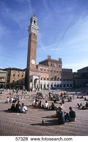 Tourists in front of clock tower, Torre del Mangia, Palazzo Pubblico, Piazza del Campo, Siena, Tuscany, Italy View Large Photo Image Stock Photo - Tourists in front of clock tower, Torre del Mangia, Palazzo Pubblico, Piazza del Campo, Siena, Tuscany, Italy . Fotosearch
