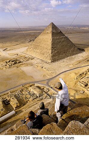 Tourists looking at Pyramid of Gizeh, Kairo, Egypt, elevated view View Large Photo Image Picture - Tourists looking at Pyramid of Gizeh, Kairo, Egypt, elevated view . Fotosearch