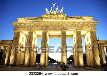 Tourists near memorial gate lit up at dusk, Brandenburg Gate, Berlin, Germany View Large Photo Image Picture - Tourists near memorial gate lit up at dusk, Brandenburg Gate, Berlin, Germany . Fotosearch