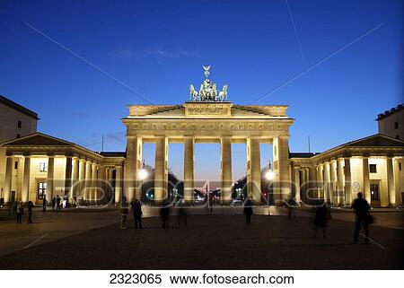 Tourists near memorial gate lit up at dusk, Brandenburg Gate, Berlin, Germany View Large Photo Image Stock Photography - Tourists near memorial gate lit up at dusk, Brandenburg Gate, Berlin, Germany . Fotosearch