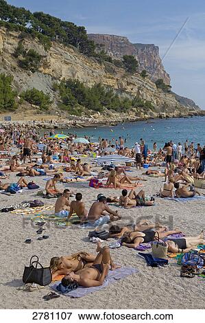 Tourists on beach, Cassis, Bouches-du-Rhone, Provence-Alpes-Cote d'Azur, France View Large Photo Image Stock Photo - Tourists on beach, Cassis, Bouches-du-Rhone, Provence-Alpes-Cote d'Azur, France . Fotosearch