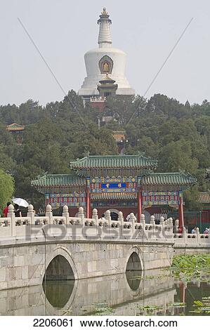 Tourists on bridge across pond, White Dagoba Temple, Beijing, China View Large Photo Image Stock Image - Tourists on bridge across pond, White Dagoba Temple, Beijing, China . Fotosearch