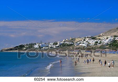 Tourists on the beach, Fuerteventura, Canary Islands, Spain View Large Photo Image Picture - Tourists on the beach, Fuerteventura, Canary Islands, Spain . Fotosearch