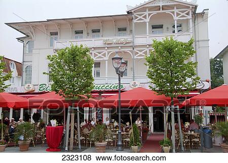 Tourists sitting at roadside cafe View Large Photo Image Stock Photo - Tourists sitting at roadside cafe . Fotosearch